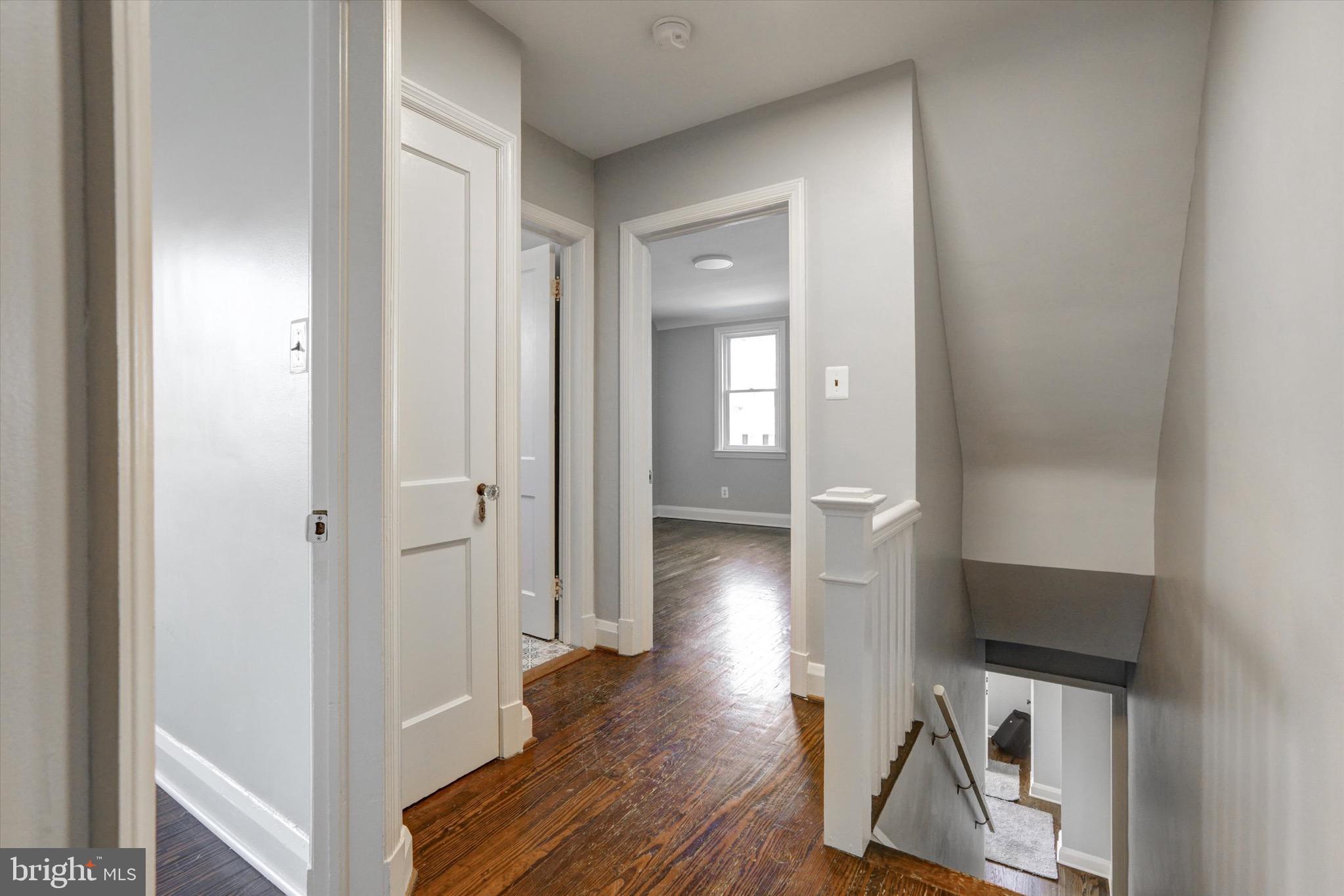 3111 Willoughby Road Baltimore, MD 21234 - Photo 20 of 45 a view of a hallway with wooden floor and a bathroom