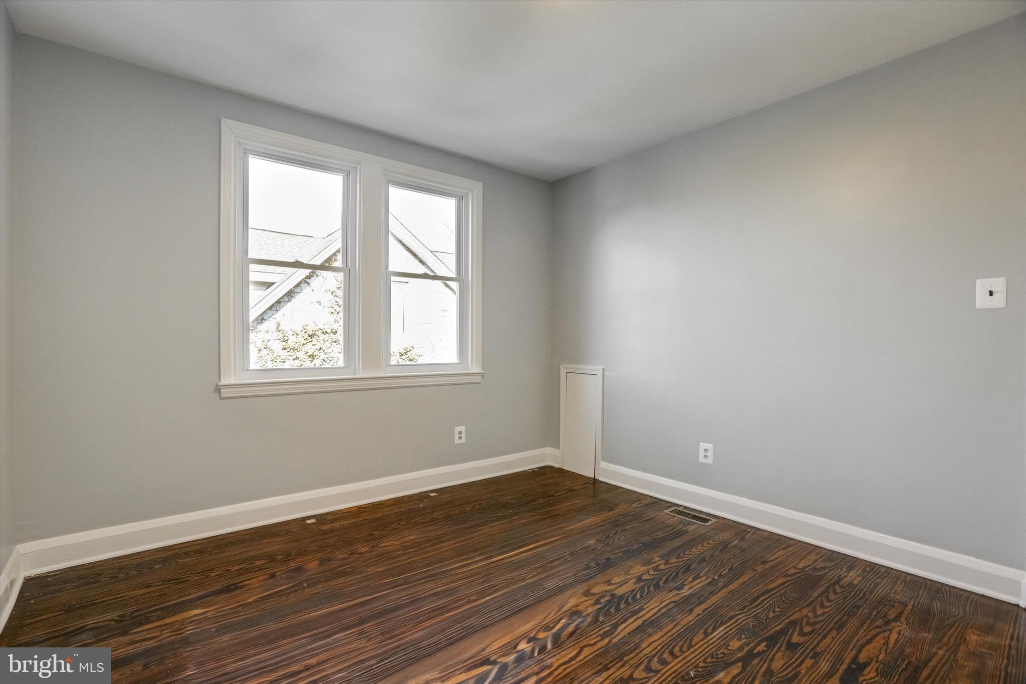 3111 Willoughby Road Baltimore, MD 21234 - Photo 25 of 45 a view of a room with wooden floor and windows in it