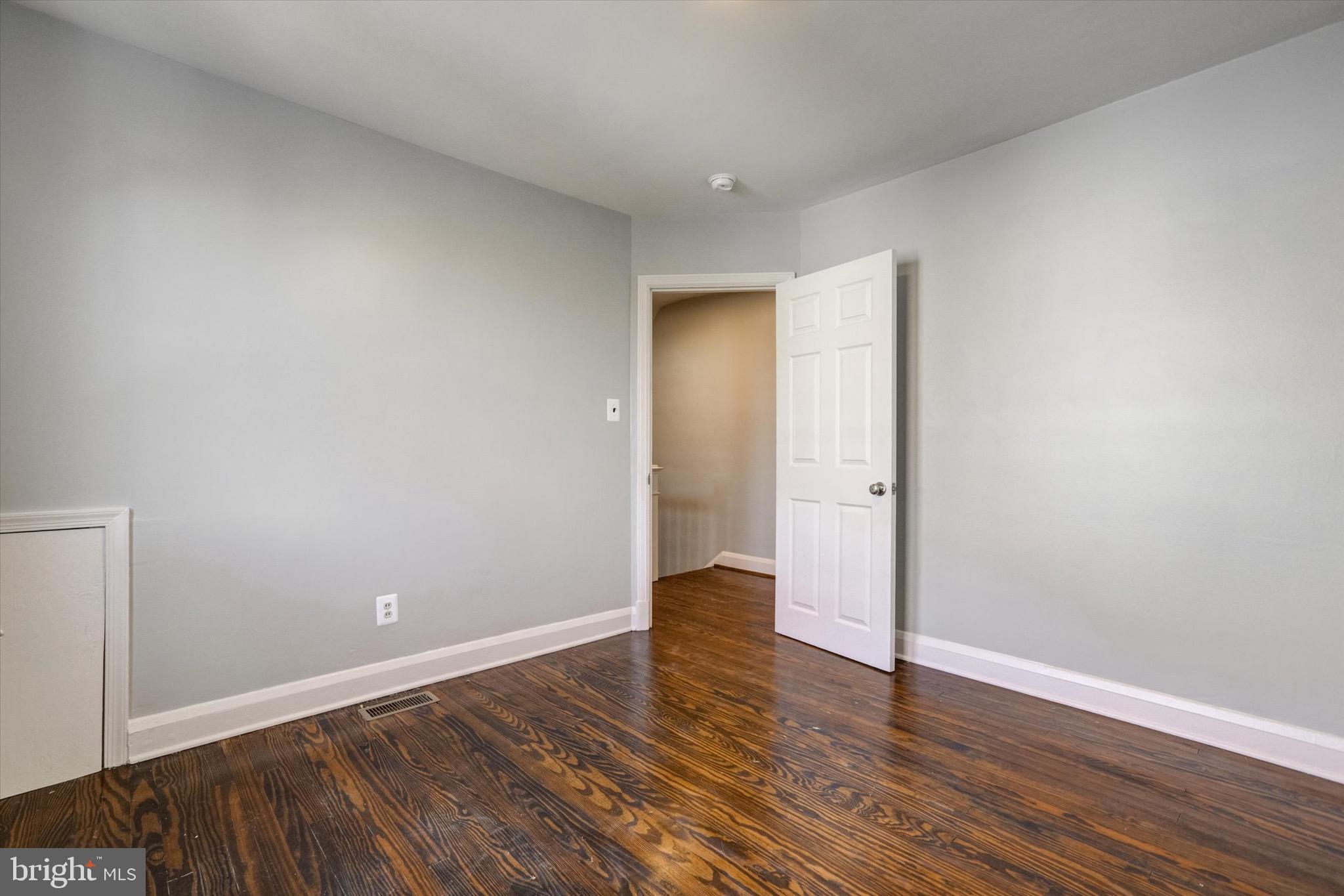 3111 Willoughby Road Baltimore, MD 21234 - Photo 26 of 45 a view of an empty room with wooden floor