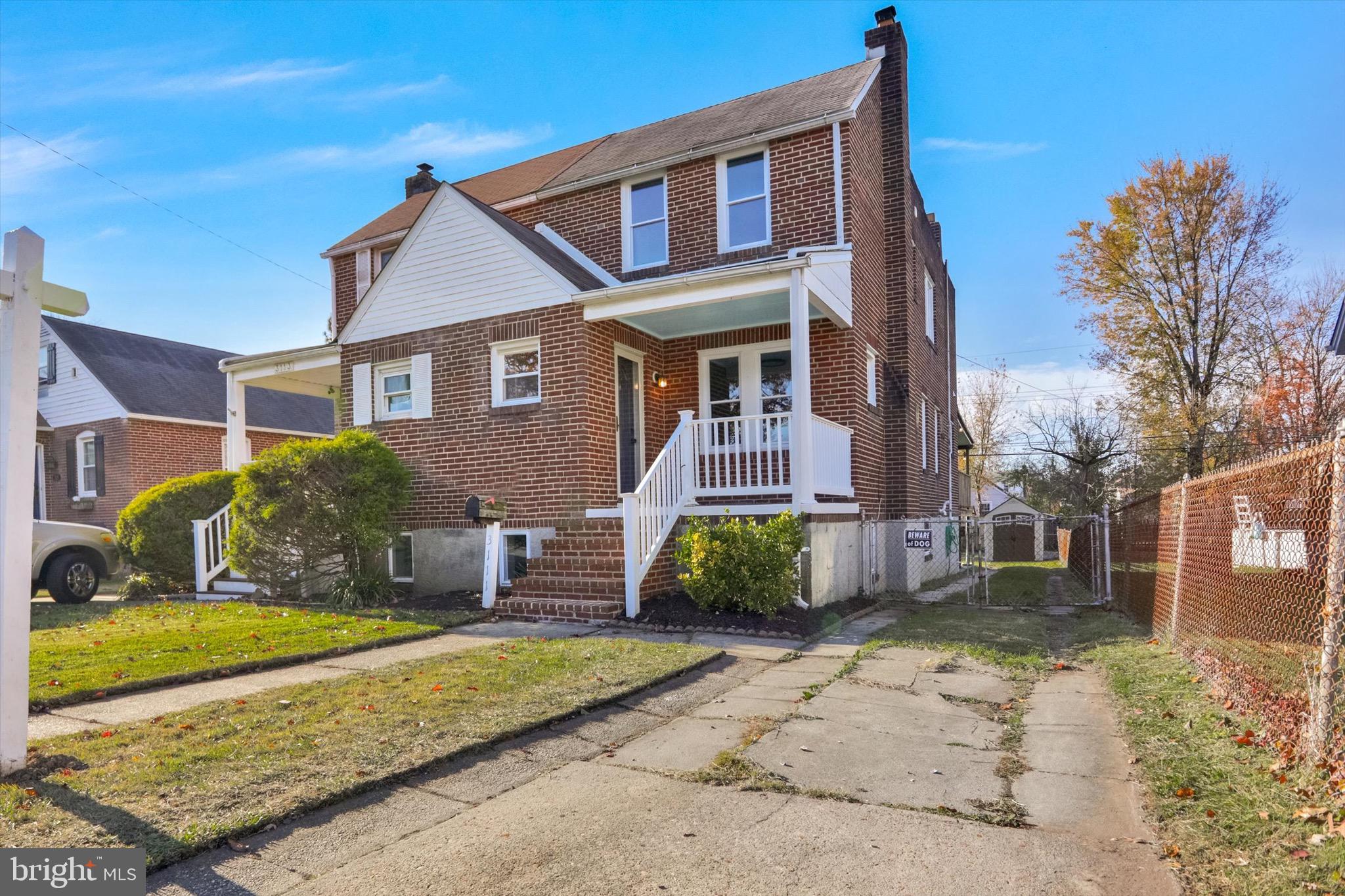 3111 Willoughby Road Baltimore, MD 21234 - Photo 4 of 45 a front view of a house with a yard