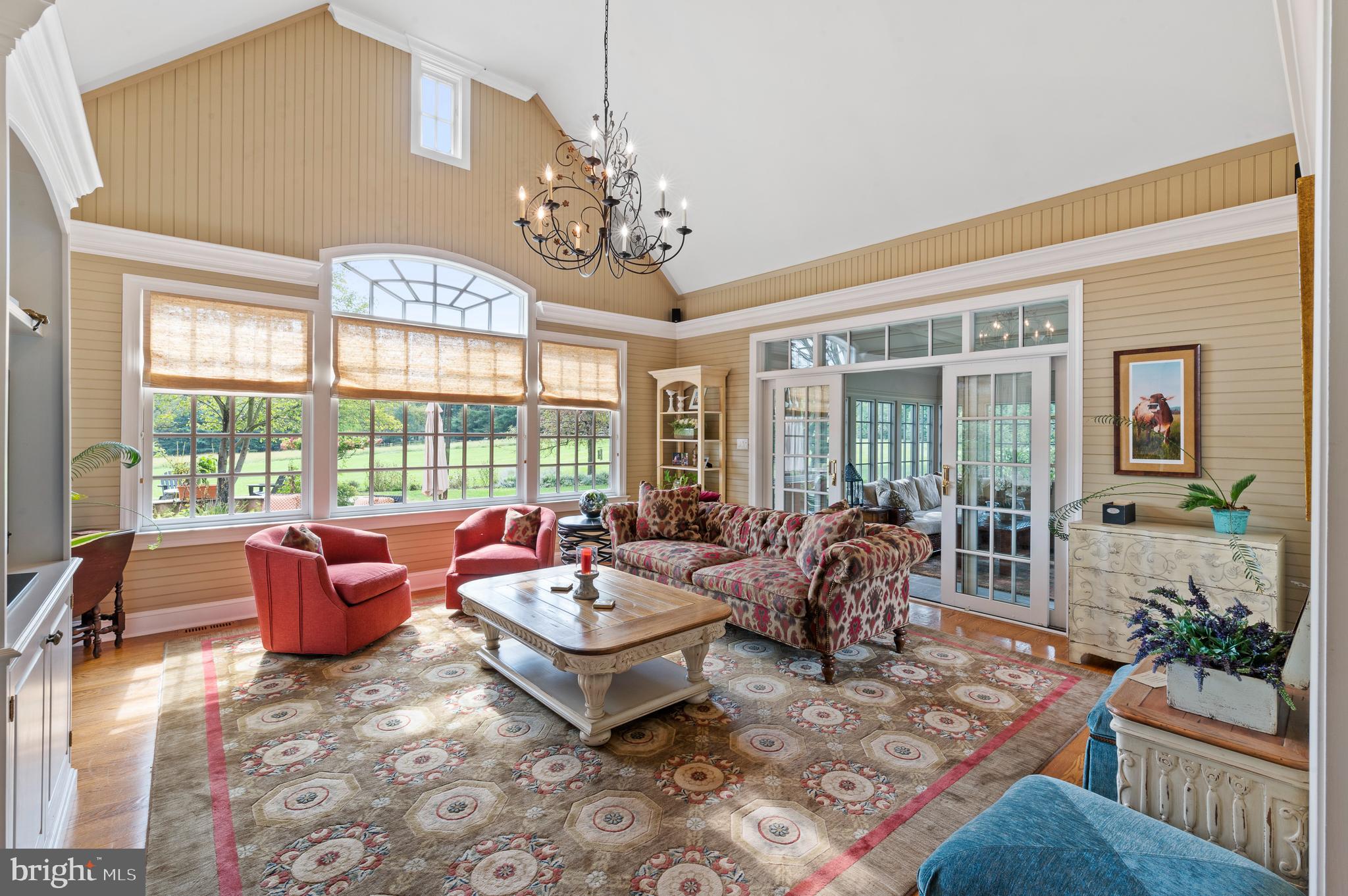 335 Boot Road Malvern, PA 19355 - Photo 17 of 65 a living room with furniture and a chandelier