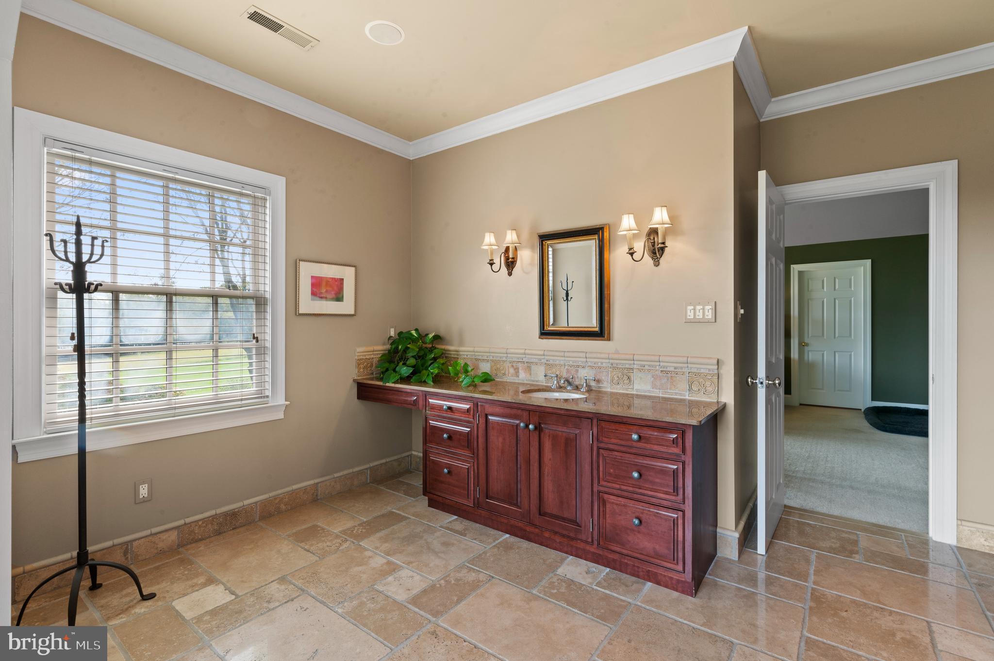 335 Boot Road Malvern, PA 19355 - Photo 33 of 65 a spacious bathroom with a granite countertop sink and a mirror
