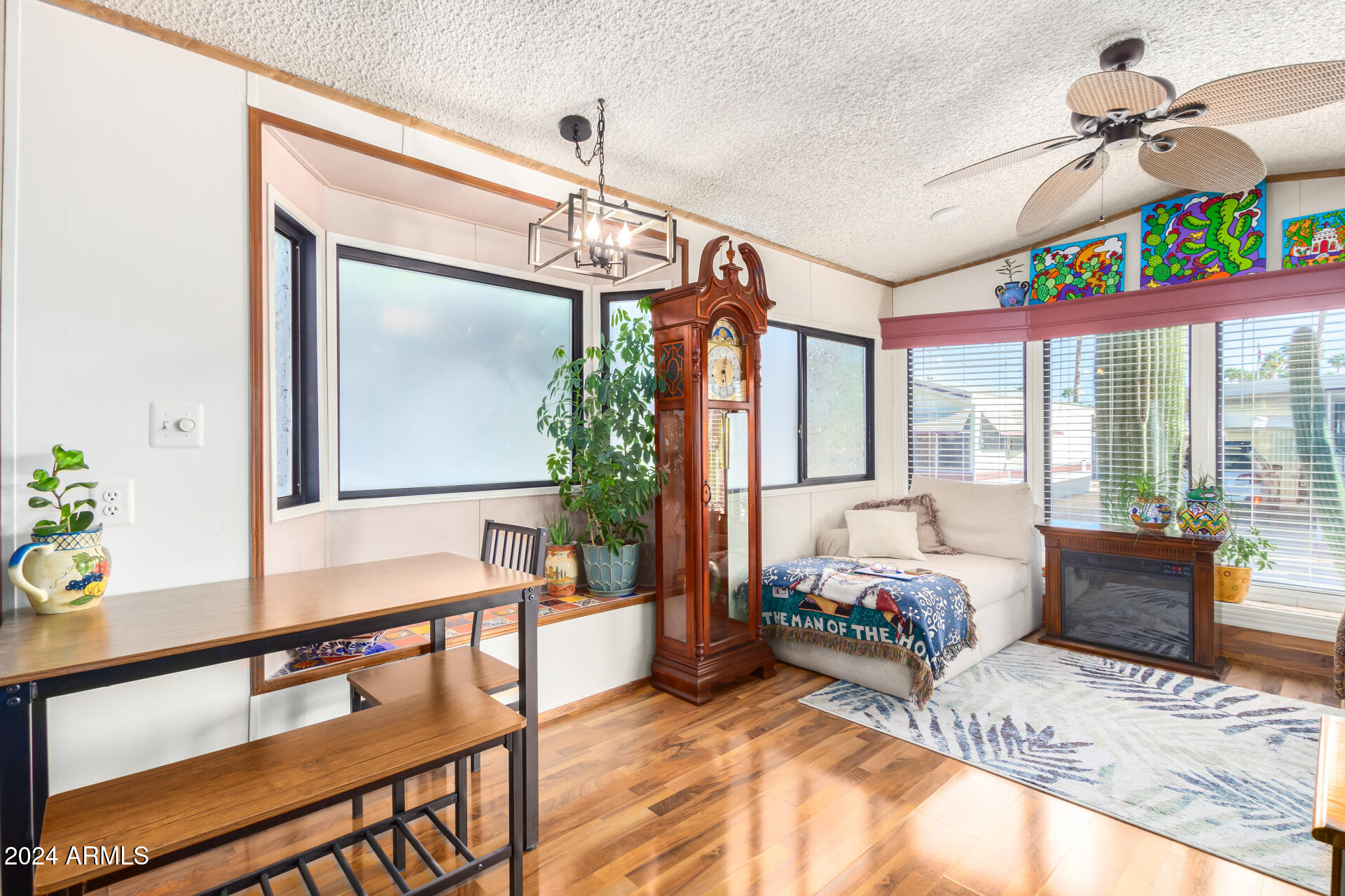 4555 South Mission Road, Unit J343 Tucson, AZ 85746 - Photo 11 of 26 a living room with furniture and a window