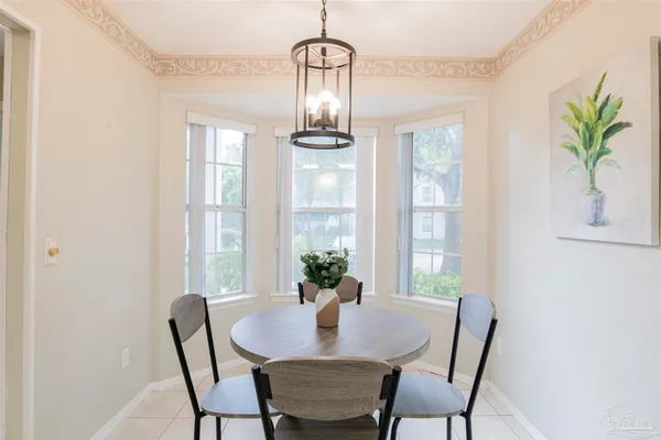 a view of a dining room with furniture window and outside view