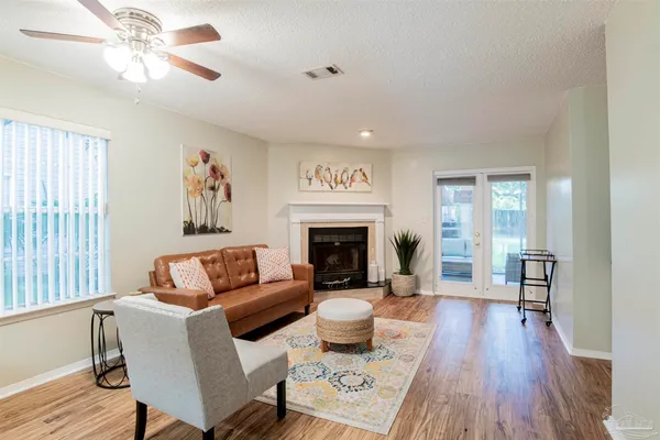 a living room with furniture and a fireplace