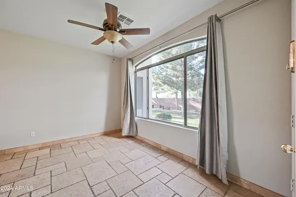 a view of an empty room and window
