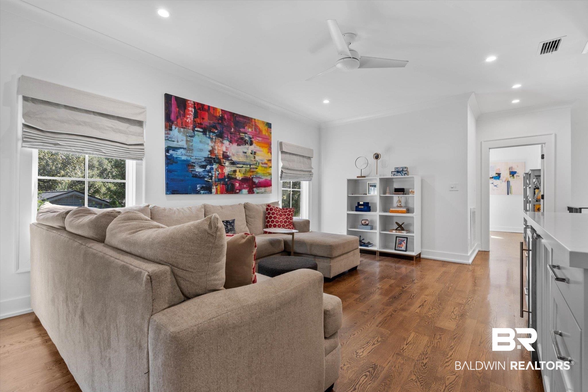 4602 Kingswood Drive Mobile, AL 36608 - Photo 22 of 45 Living room featuring wood finished floors, recessed lighting, crown molding, wine cooler, and a ceiling fan