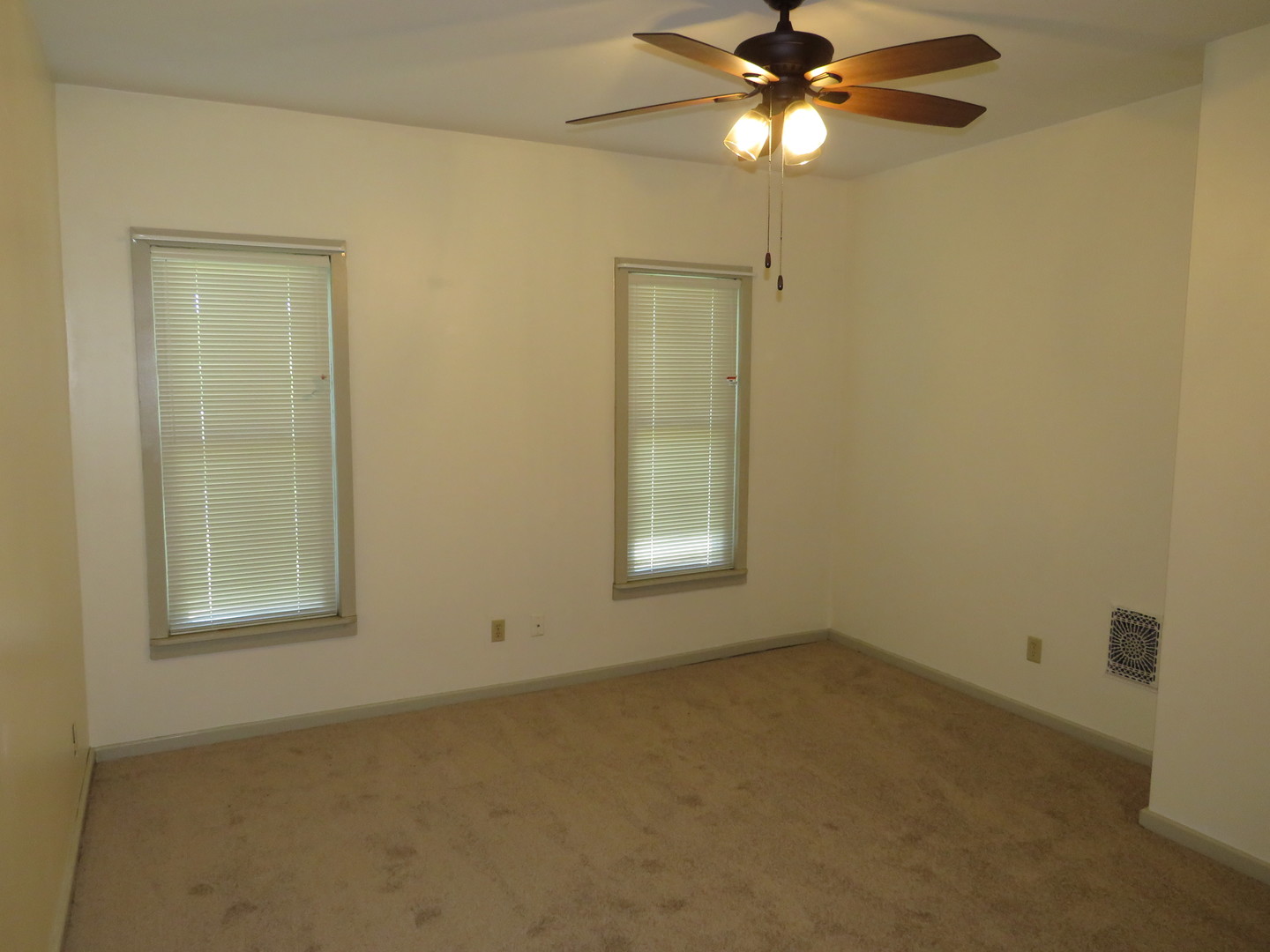 304 East Main Street, Unit A Ottawa, IL 61350 - Photo 14 of 22 an empty room with windows and fan