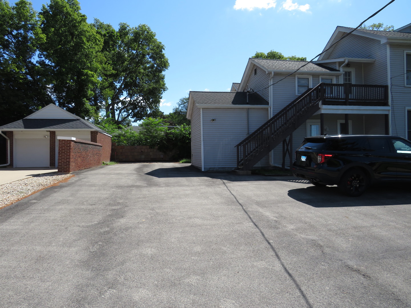 304 East Main Street, Unit A Ottawa, IL 61350 - Photo 20 of 22 a view of a house with a wooden bench