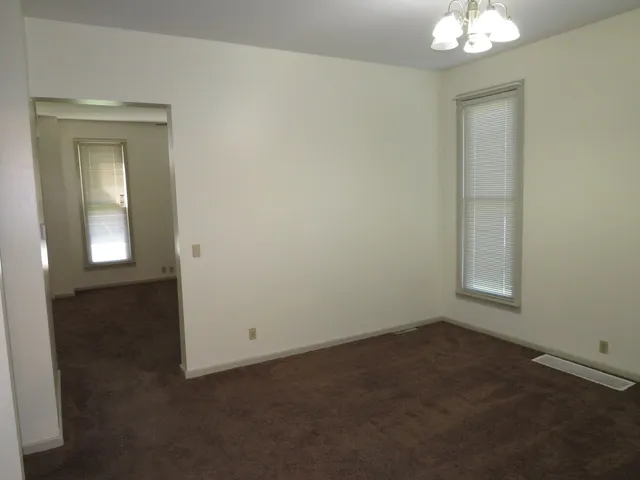 an empty room with a mirror