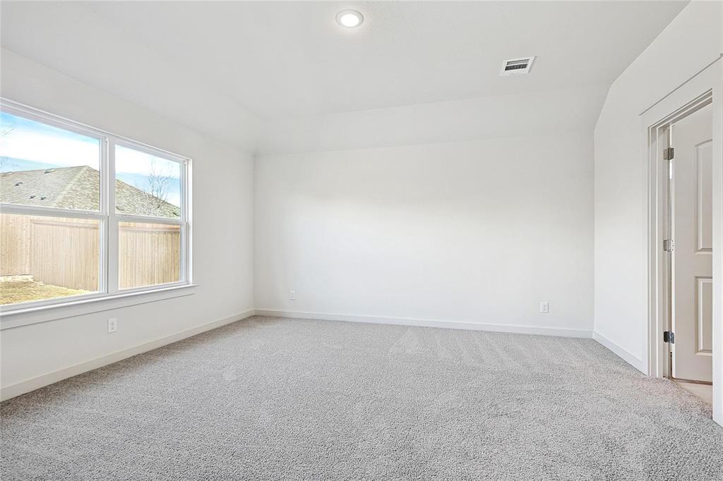1759 Gleasondale Place Forney, TX 75126 - Photo 11 of 25 Spare room featuring carpet flooring and recessed lighting