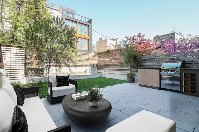 a view of a patio with couches table and chairs and potted plants