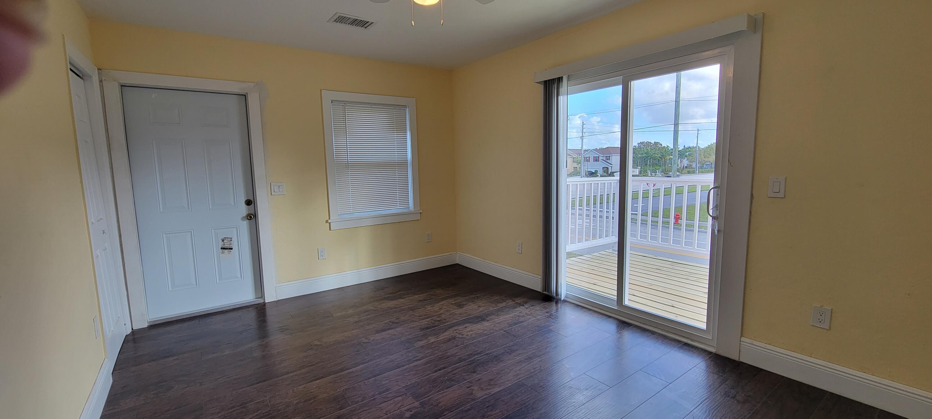 5023 Club Road Haverhill, FL 33415 - Photo 9 of 18 UPSTAIRS LIVING WITH BALCONY