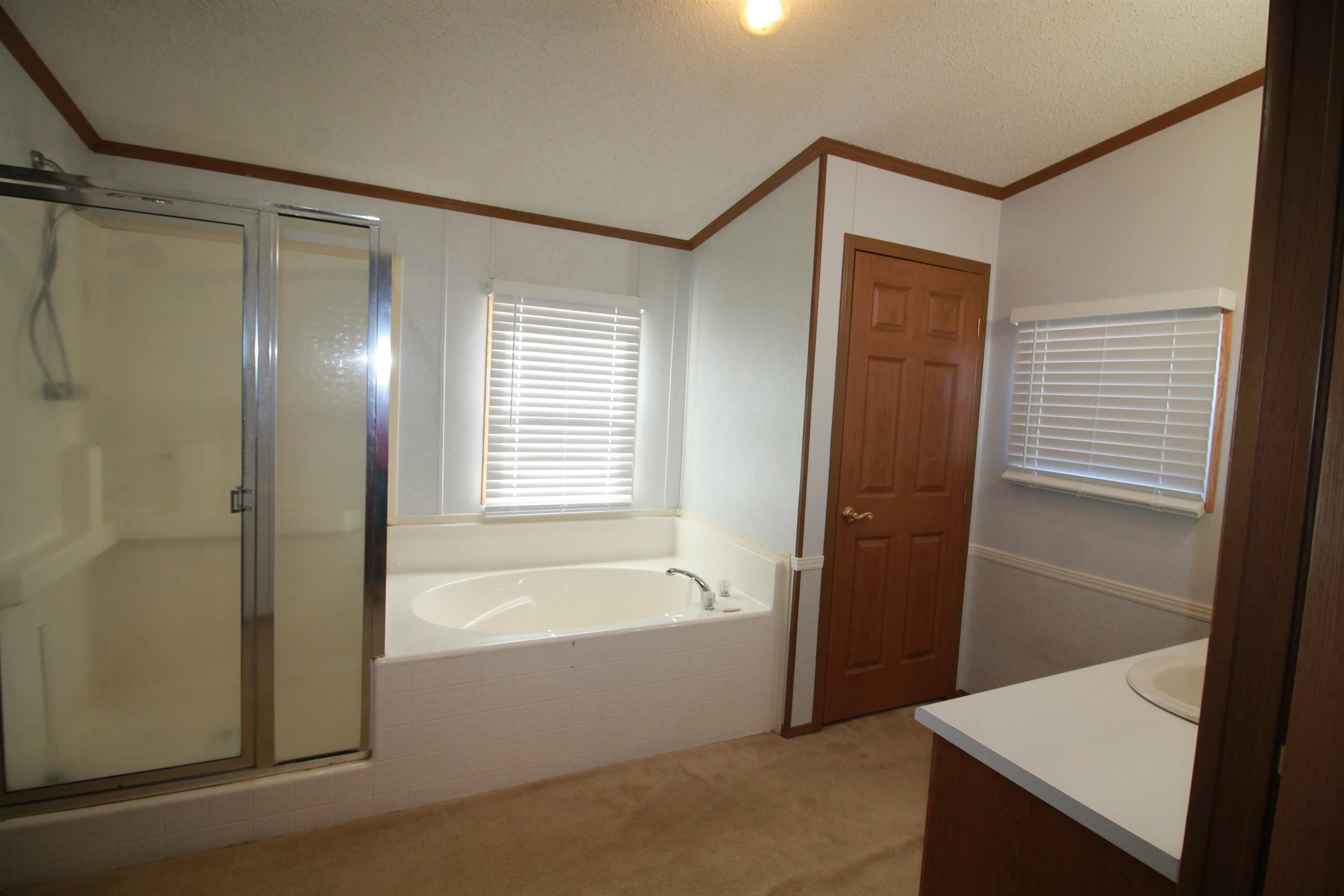 1709 Sanford Road Covington, TN 38019 - Photo 10 of 20 a bathroom with a bathtub and a shower