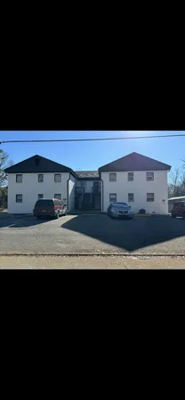 a view of building with yard
