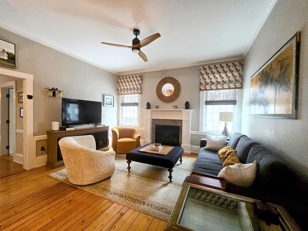 199 Rhode Island Road Lakeville, MA 02347 - Photo 11 of 30 a living room with furniture a fireplace and a flat screen tv