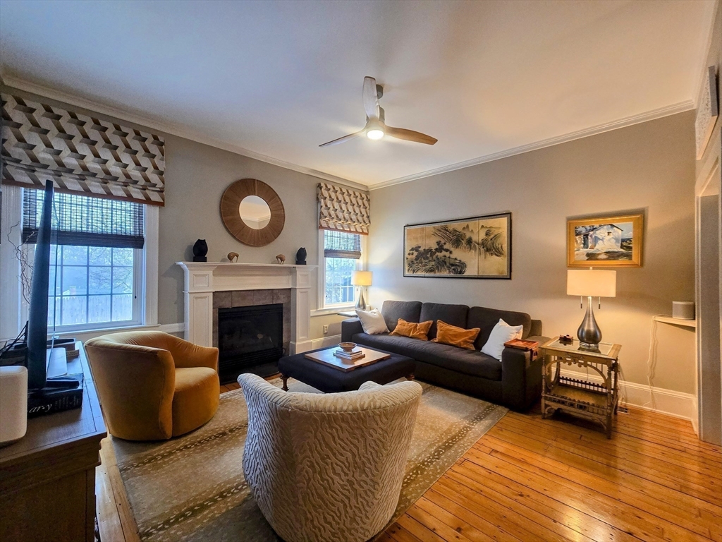 199 Rhode Island Road Lakeville, MA 02347 - Photo 12 of 30 a living room with furniture a fireplace and a window