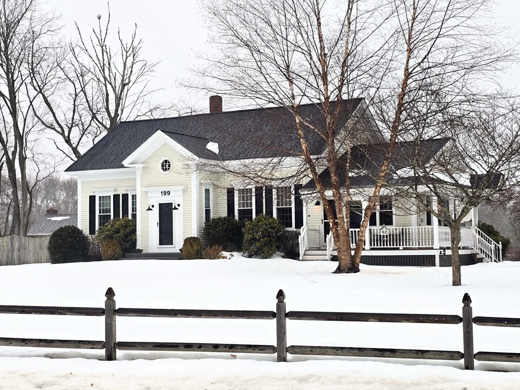 199 Rhode Island Road Lakeville, MA 02347 - Photo 2 of 30 a view of a white house with a yard covered in snow