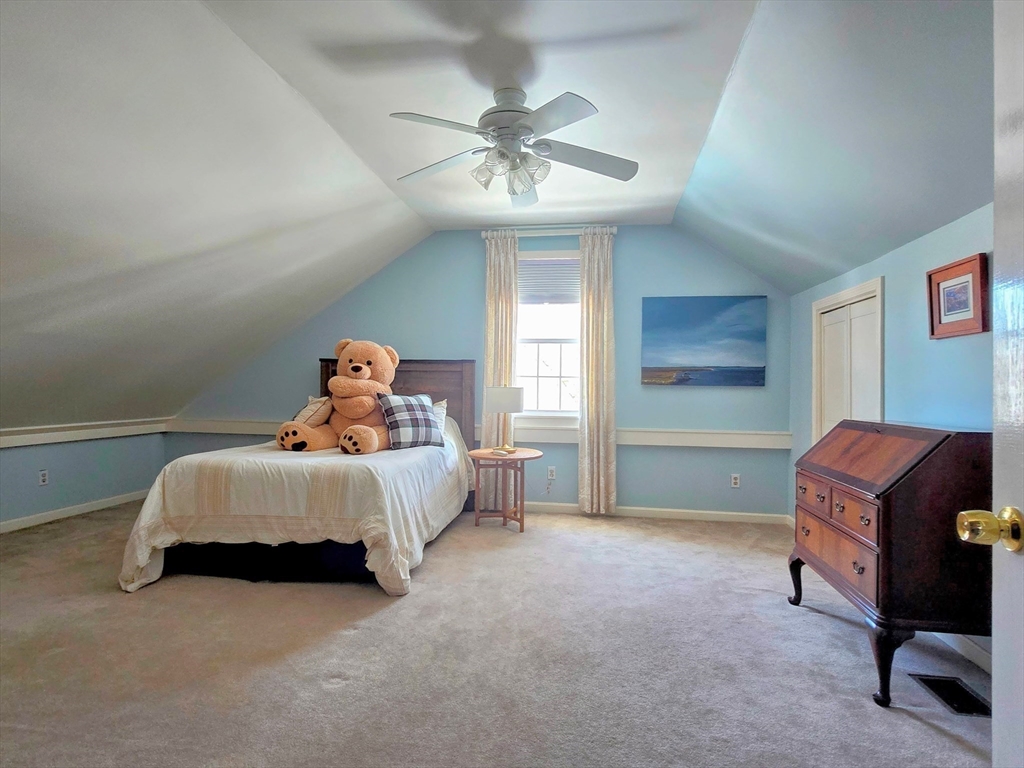 199 Rhode Island Road Lakeville, MA 02347 - Photo 22 of 30 a bed room with a bed and a chandelier