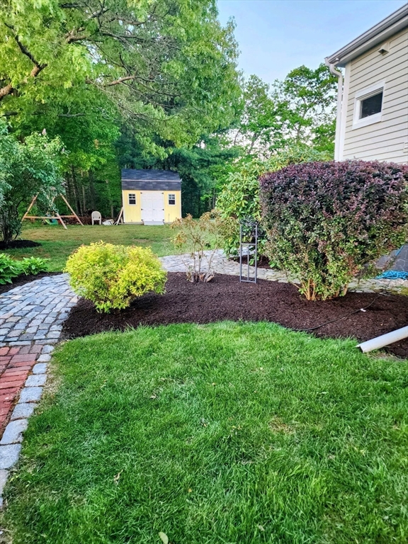 199 Rhode Island Road Lakeville, MA 02347 - Photo 25 of 30 a front view of a house with garden