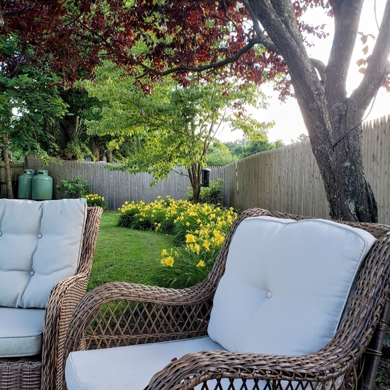 199 Rhode Island Road Lakeville, MA 02347 - Photo 5 of 30 a view of a backyard with a tub and trees