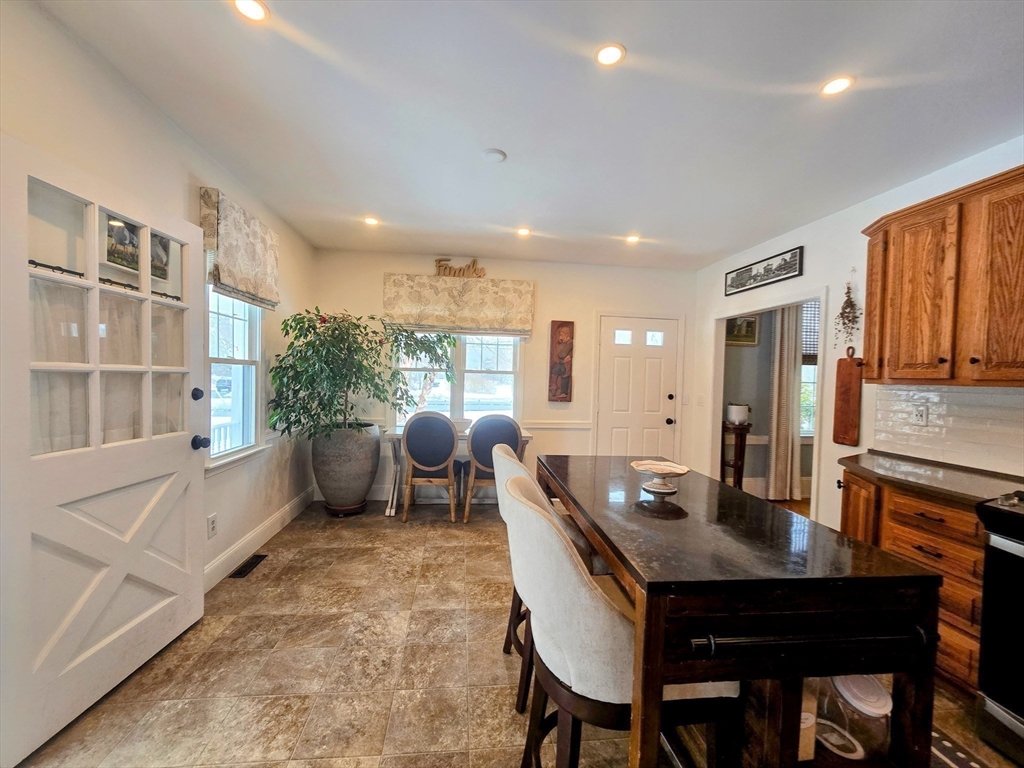 199 Rhode Island Road Lakeville, MA 02347 - Photo 6 of 30 a living room with furniture a large window and dining table