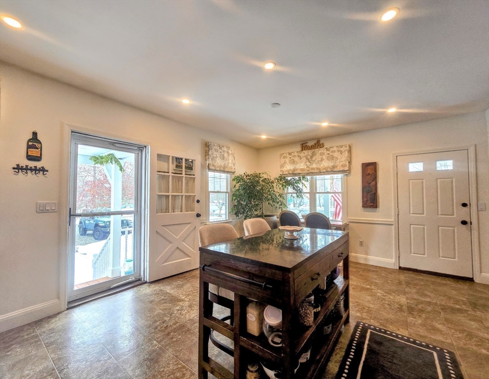 199 Rhode Island Road Lakeville, MA 02347 - Photo 8 of 30 a dining hall with stainless steel appliances granite countertop a stove and a refrigerator