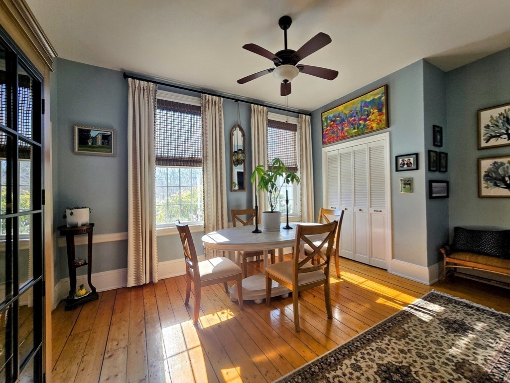 199 Rhode Island Road Lakeville, MA 02347 - Photo 10 of 30 a view of a dining room with furniture window and wooden floor