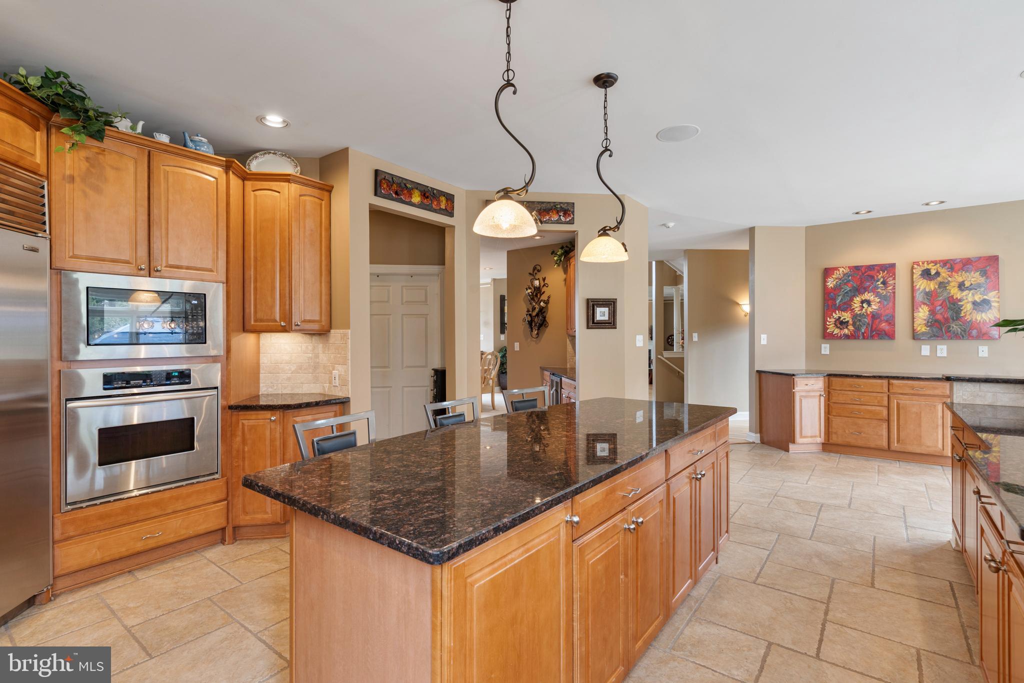 100 East Holland Road Holland, PA 18966 - Photo 11 of 63 a kitchen with stainless steel appliances granite countertop a sink a oven and a refrigerator