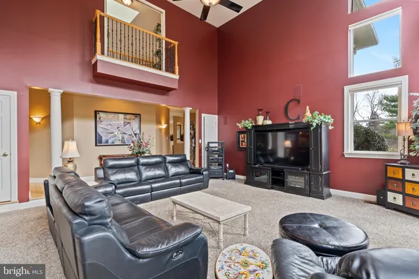 a living room with furniture a window and a fireplace