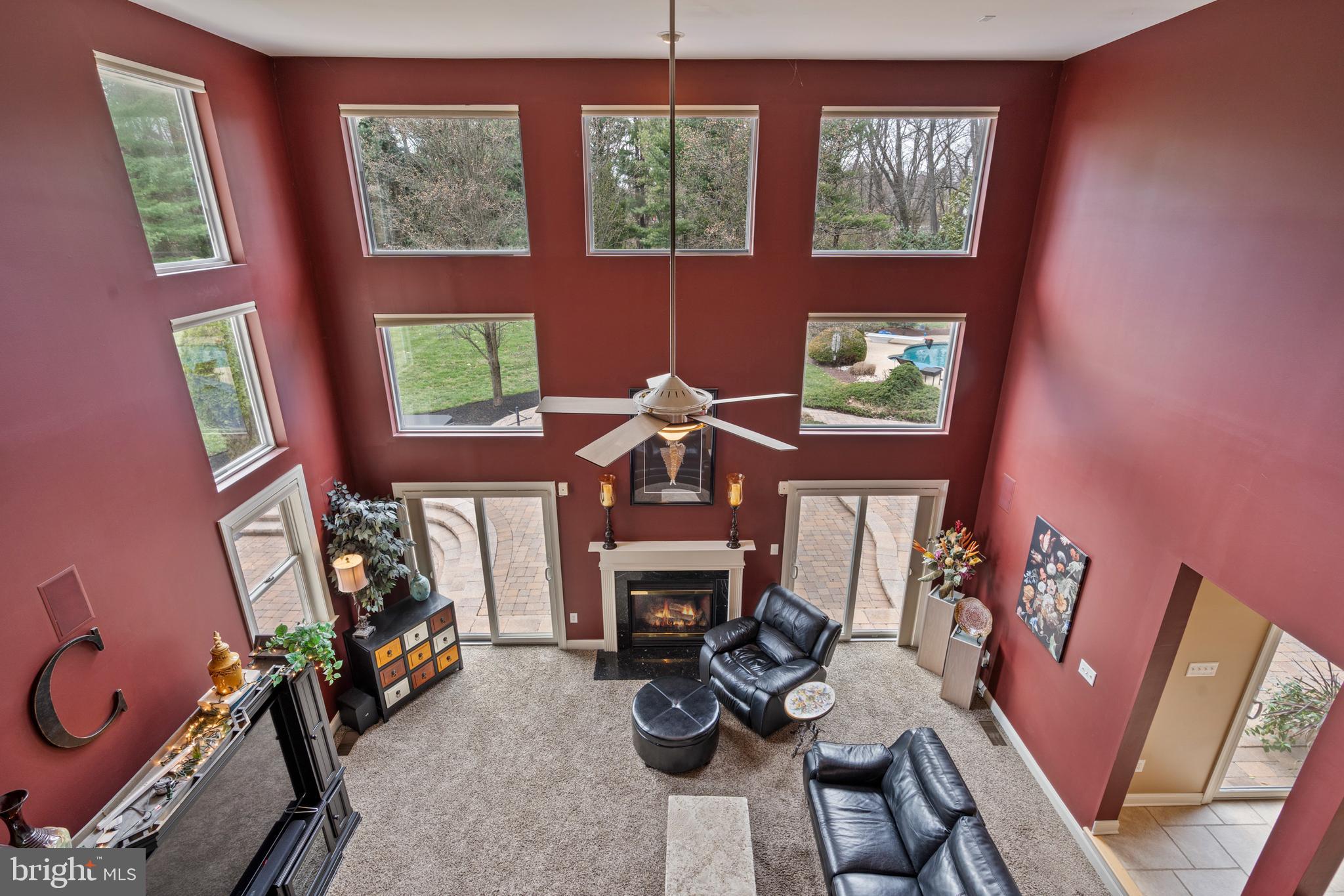 100 East Holland Road Holland, PA 18966 - Photo 16 of 63 a living room with furniture a window and a fireplace