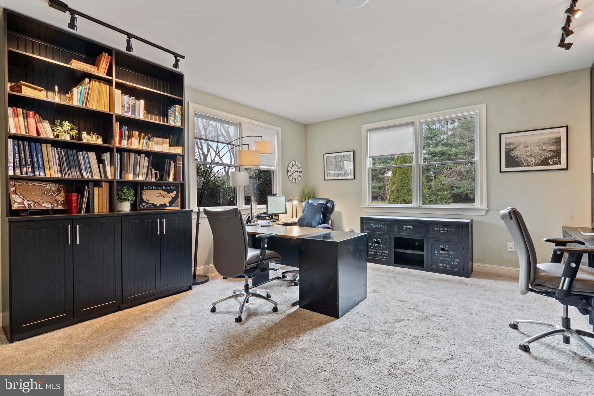 100 East Holland Road Holland, PA 18966 - Photo 17 of 63 a view of a workspace with furniture and a bookshelf