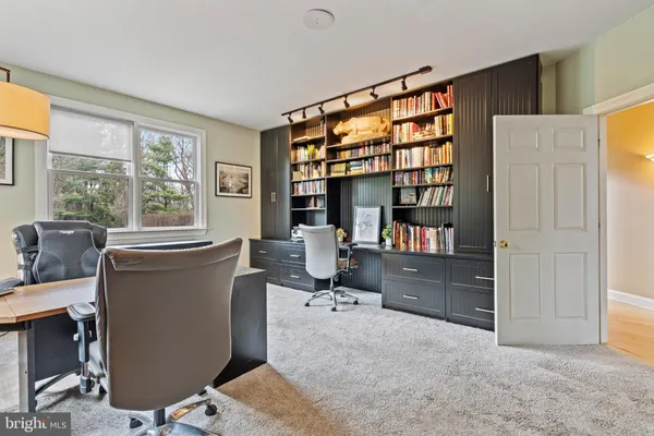 a bathroom with a sink a mirror and shower