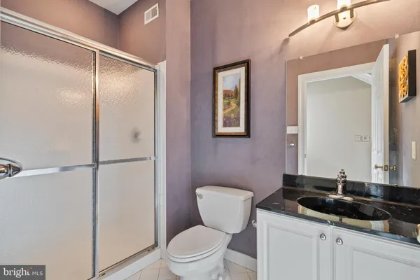 a bedroom with furniture and a flat screen tv