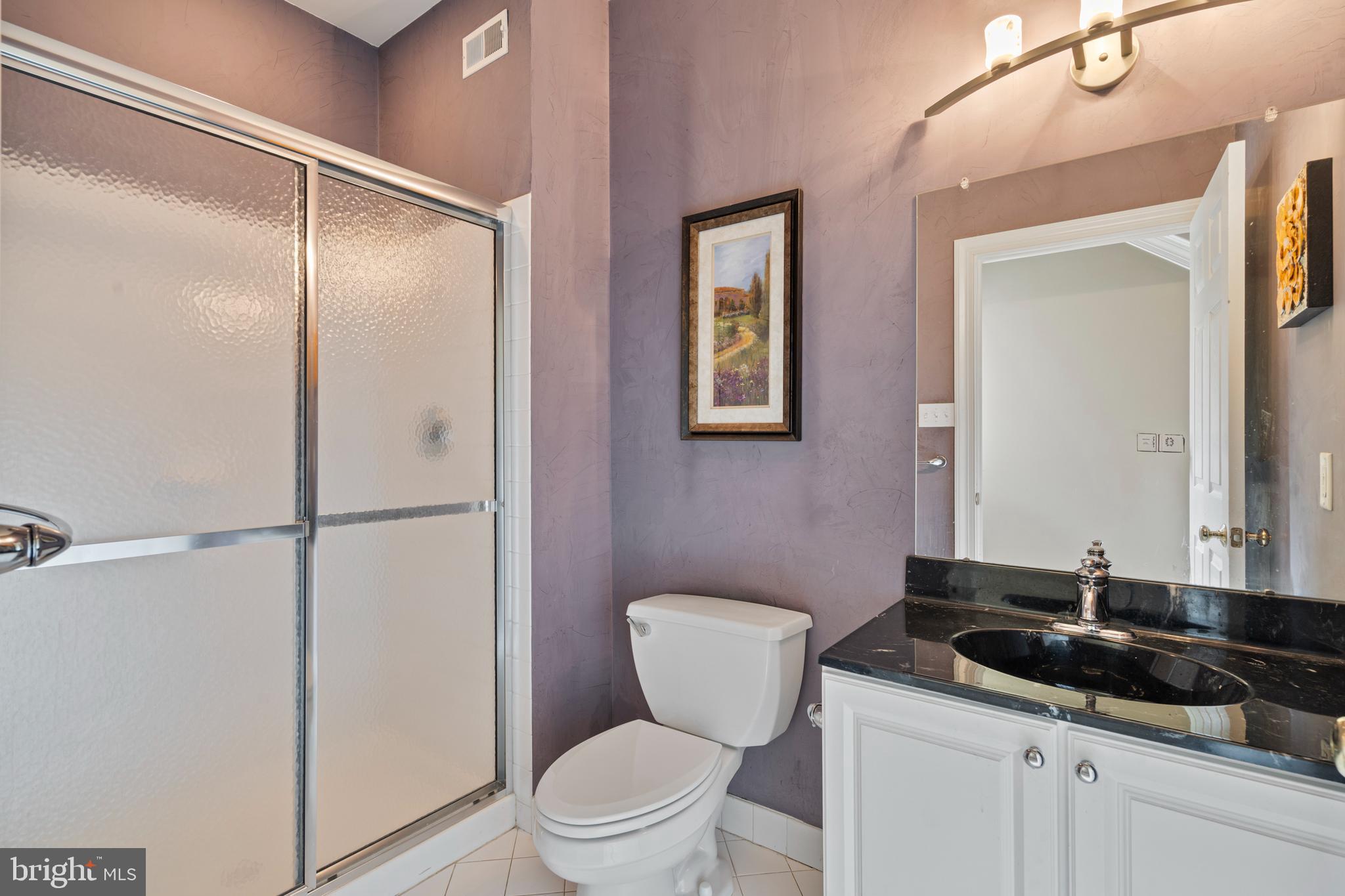 100 East Holland Road Holland, PA 18966 - Photo 21 of 63 a bathroom with a granite countertop sink toilet and shower