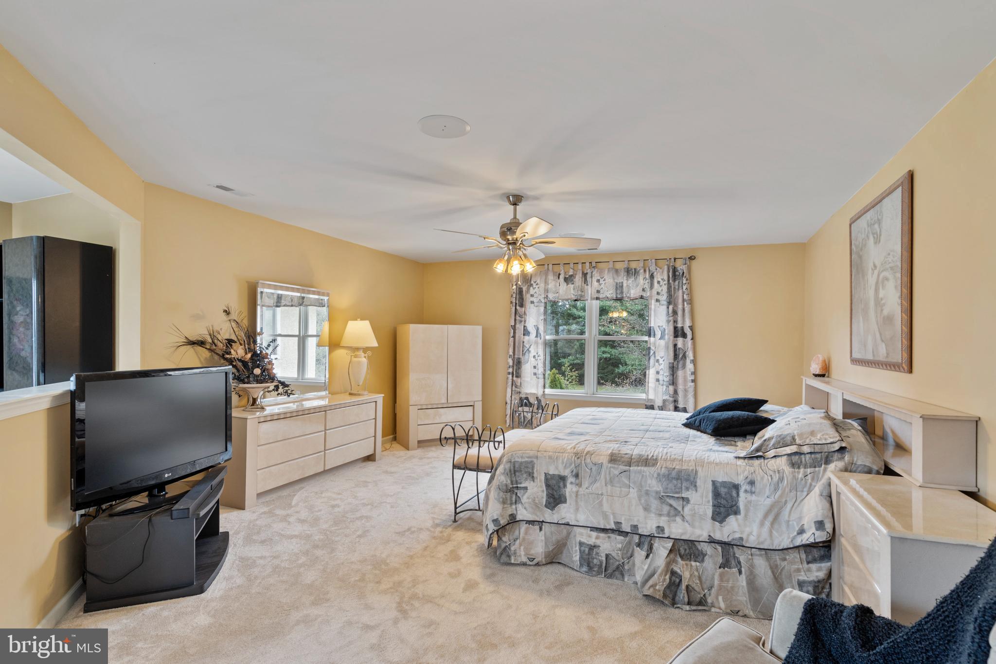 100 East Holland Road Holland, PA 18966 - Photo 22 of 63 a bedroom with furniture and a flat screen tv