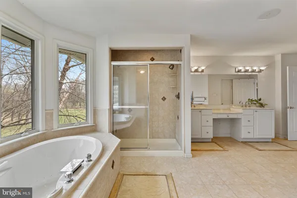 a en suite bathroom with a sink and a mirror