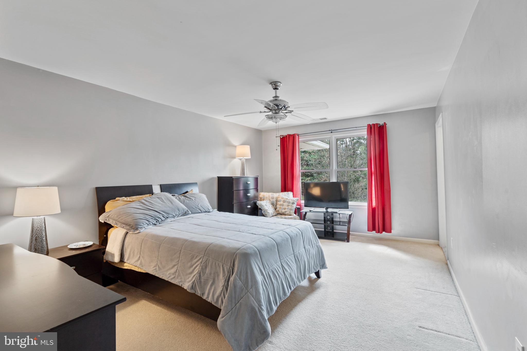 100 East Holland Road Holland, PA 18966 - Photo 27 of 63 a bedroom with a large bed and a large window