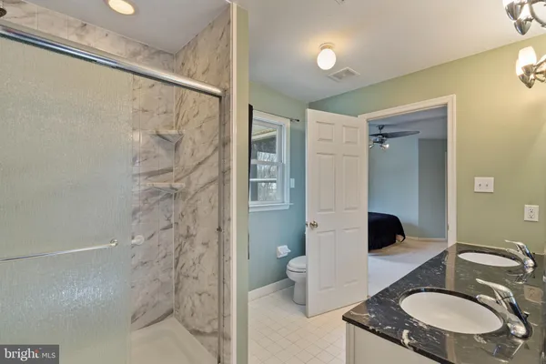 a room with furniture pool table and windows