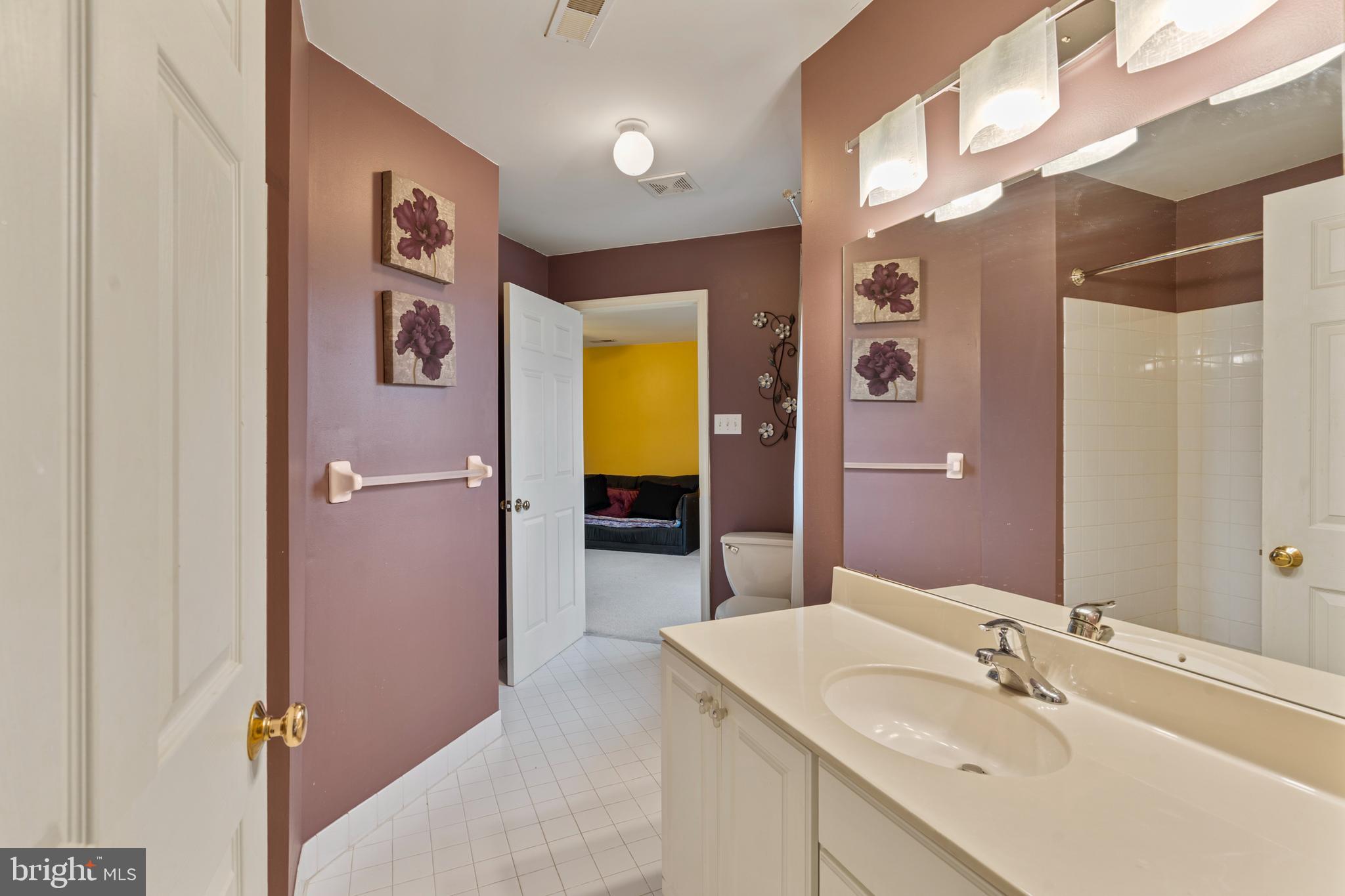 100 East Holland Road Holland, PA 18966 - Photo 31 of 63 a en suite bathroom with a sink and a mirror