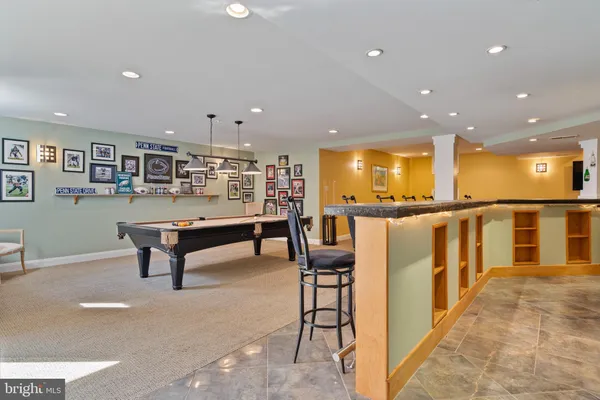 a view of an outdoor sitting area with furniture and backyard