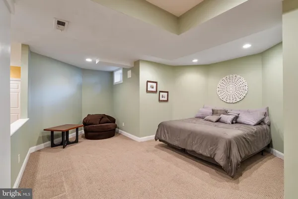 an aerial view of a house with a yard and garden