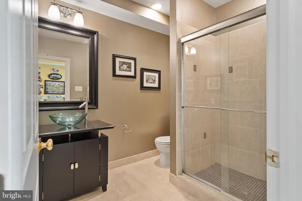 an aerial view of a house with a swimming pool outdoor seating and yard