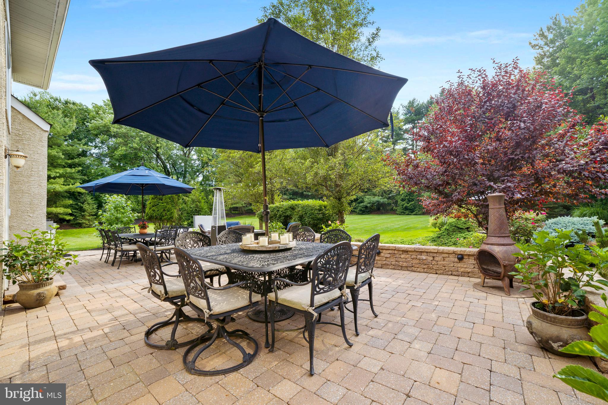 100 East Holland Road Holland, PA 18966 - Photo 41 of 63 a view of table and chairs under an umbrella