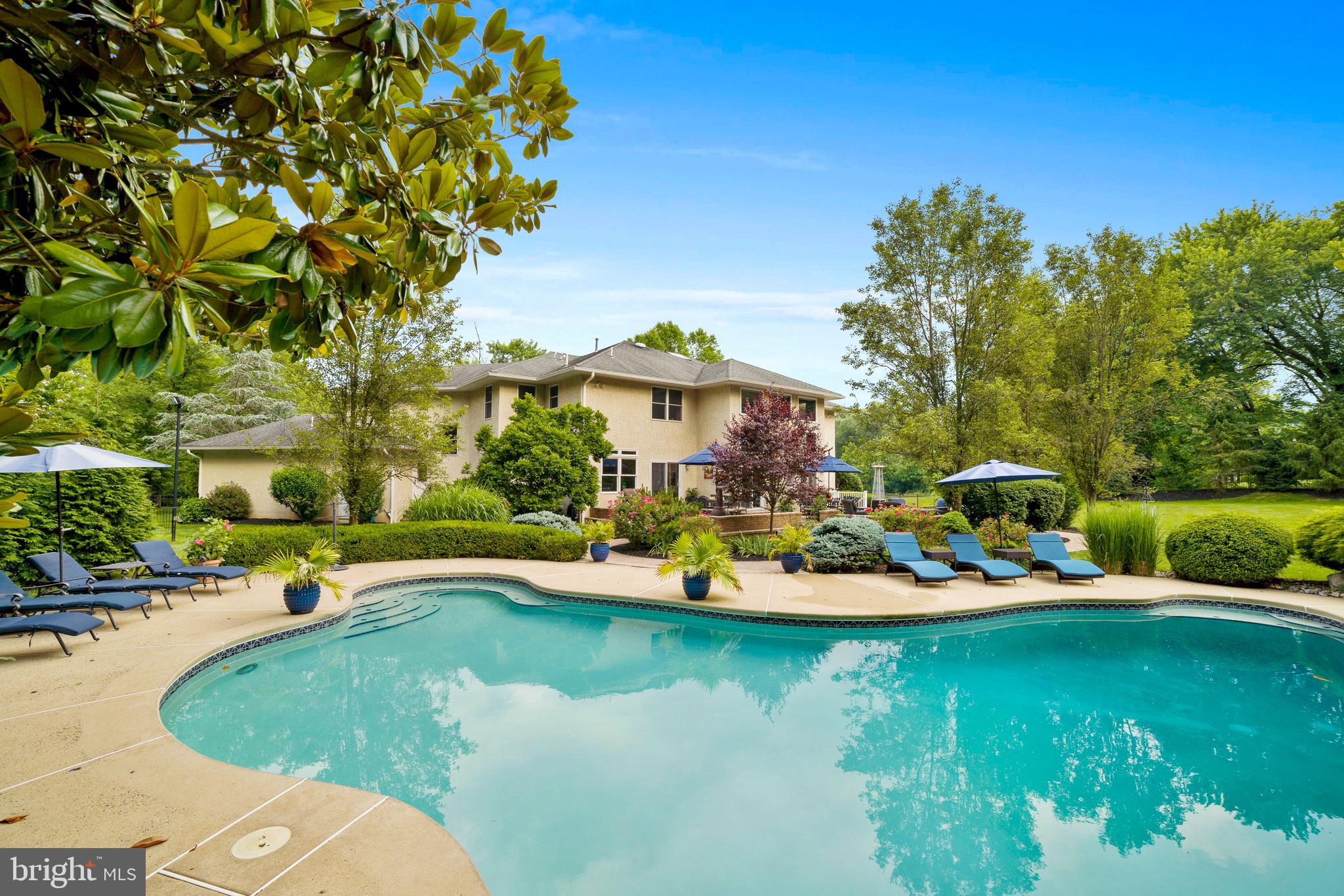 100 East Holland Road Holland, PA 18966 - Photo 47 of 63 an aerial view of a house with swimming pool a yard and lake view