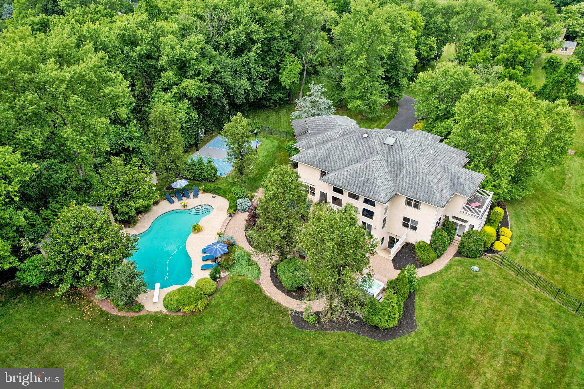 100 East Holland Road Holland, PA 18966 - Photo 51 of 63 an aerial view of a house with a swimming pool outdoor seating and yard