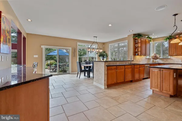 a large kitchen with lots of counter space and windows