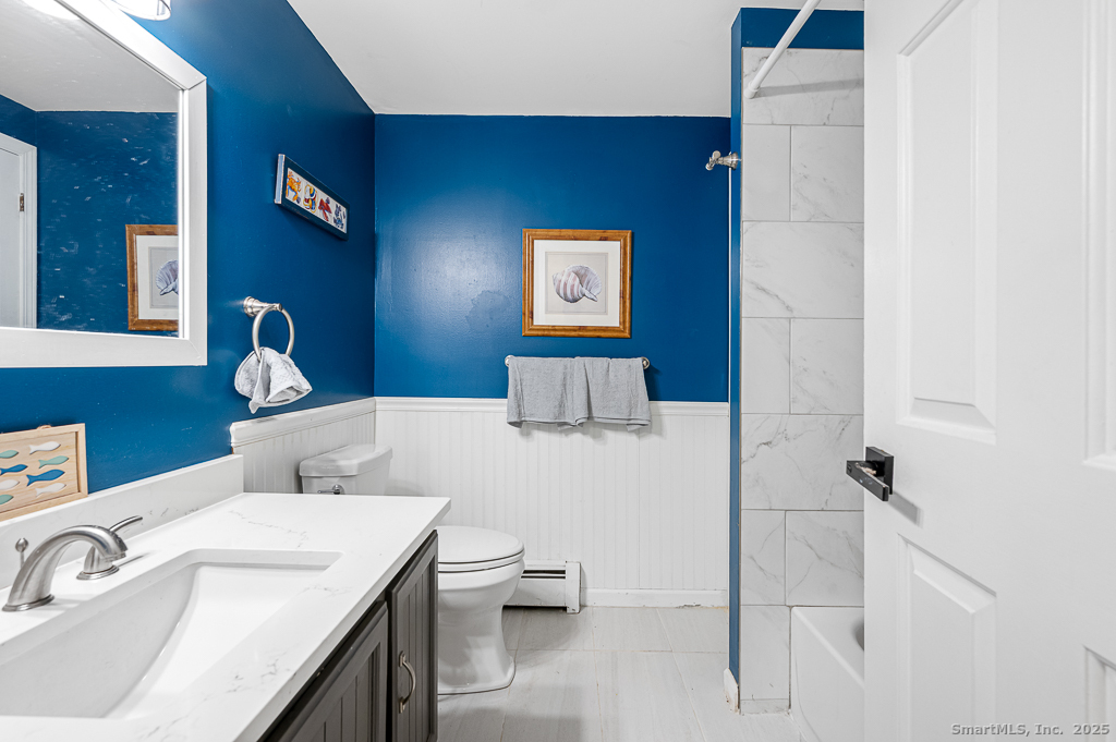 437 Somers Road Ellington, CT 06029 - Photo 12 of 40 a bathroom with a sink and a toilet