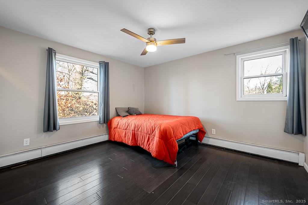 437 Somers Road Ellington, CT 06029 - Photo 14 of 40 a spacious bedroom with a bed and window