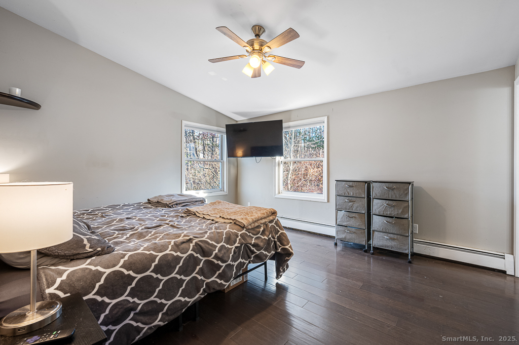 437 Somers Road Ellington, CT 06029 - Photo 16 of 40 a bedroom with a bed and a window